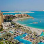 Marjan Beach in Ras Al Khaimah with clear blue water and sandy shoreline